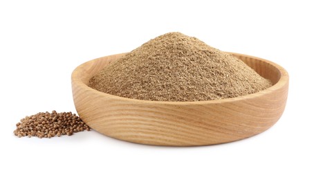 Wooden bowl with powdered coriander and corns on white background Photo of Wooden bowl with powdered coriander and corns on white background