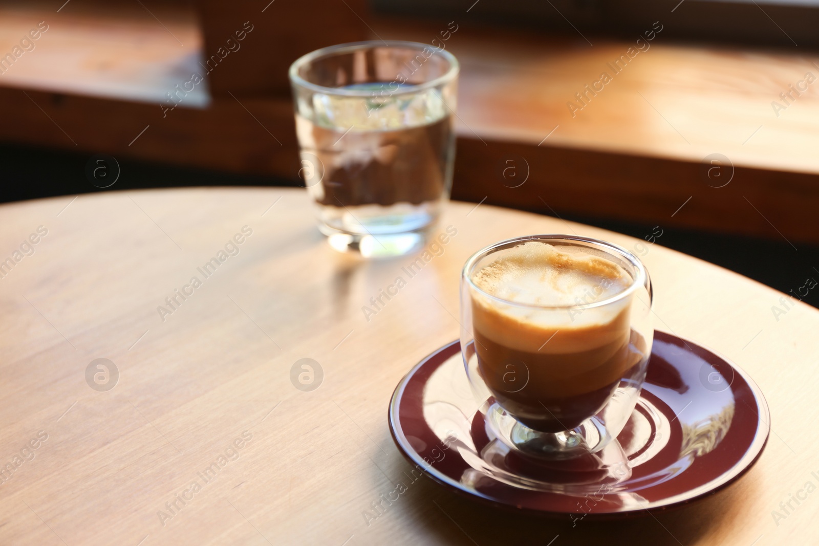 Aromatic coffee on wooden table in cafe. Space for text Photo of Aromatic coffee on wooden table in cafe. Space for text