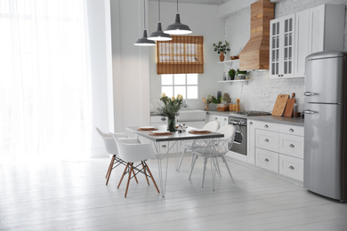 Photo of Beautiful kitchen interior with new stylish furniture