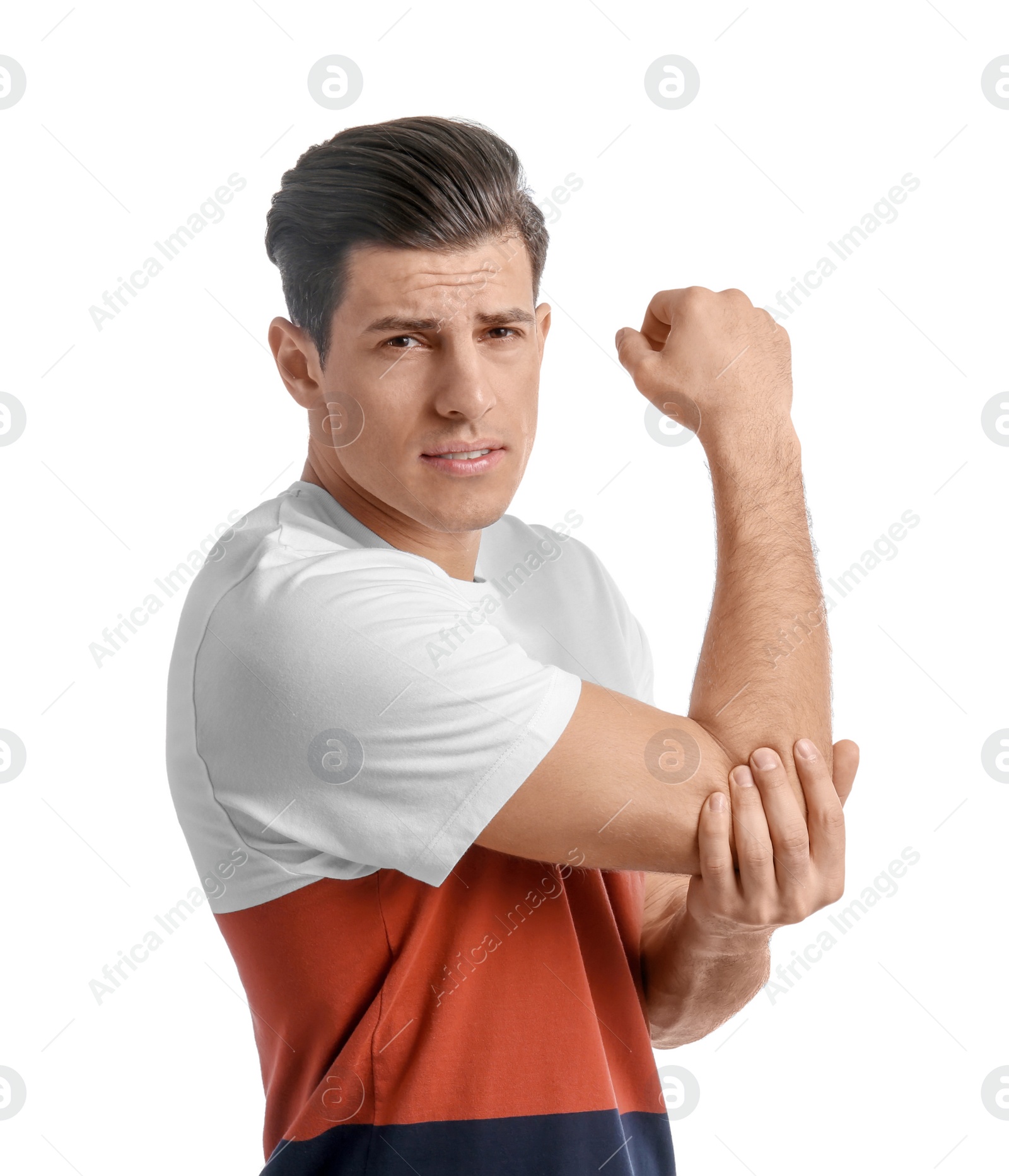 Young man suffering from pain in elbow on white background Photo of Young man suffering from pain in elbow on white background