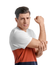 Young man suffering from pain in elbow on white background Photo of Young man suffering from pain in elbow on white background