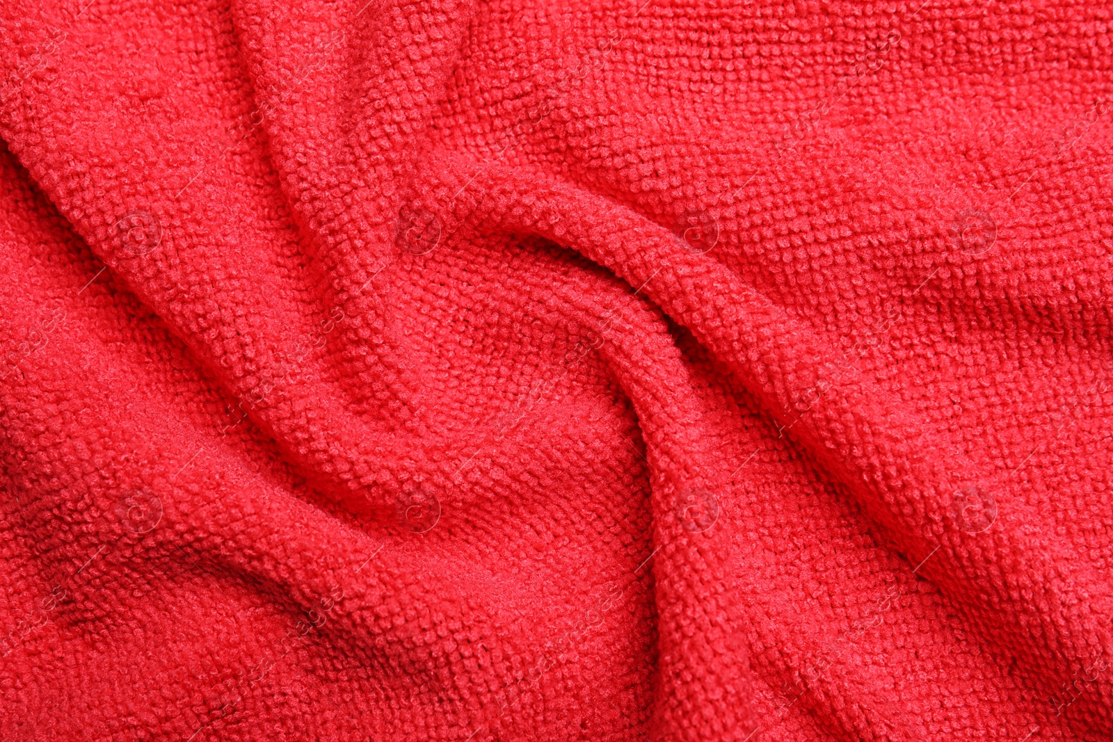 Crumpled red microfiber cloth as background, closeup Photo of Crumpled red microfiber cloth as background, closeup