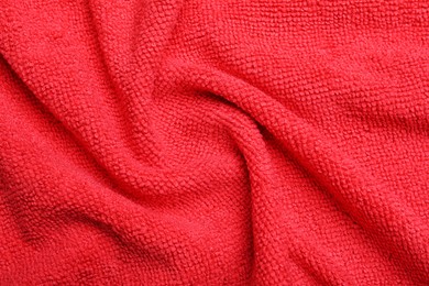 Crumpled red microfiber cloth as background, closeup Photo of Crumpled red microfiber cloth as background, closeup