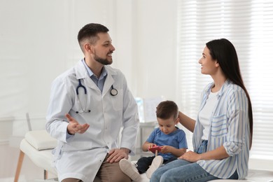 Photo of Mother and son visiting pediatrician in hospital