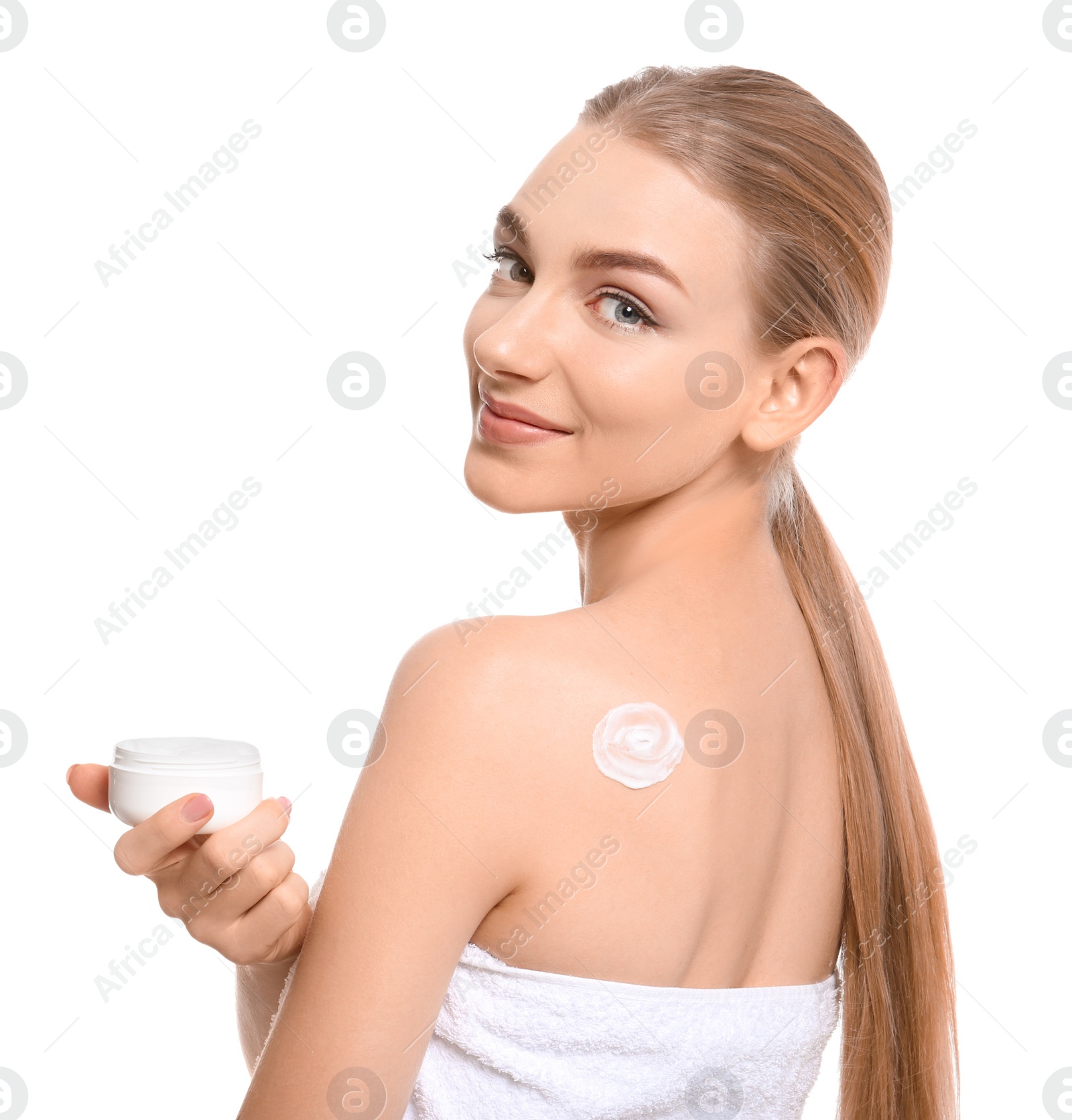 Young woman with jar of body cream on white background Photo of Young woman with jar of body cream on white background