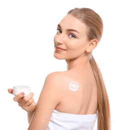 Young woman with jar of body cream on white background Photo of Young woman with jar of body cream on white background