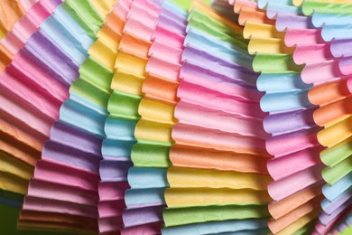 Colorful paper cupcake molds as background, closeup Photo of Colorful paper cupcake molds as background, closeup