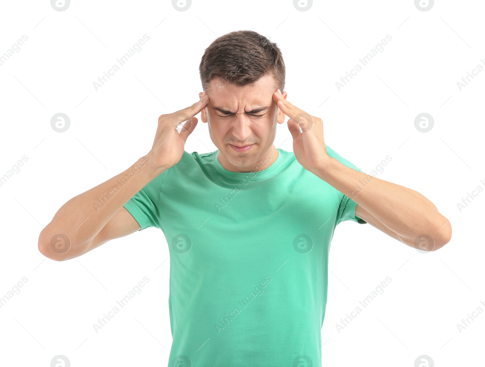 Young man suffering from headache on white background Photo of Young man suffering from headache on white background