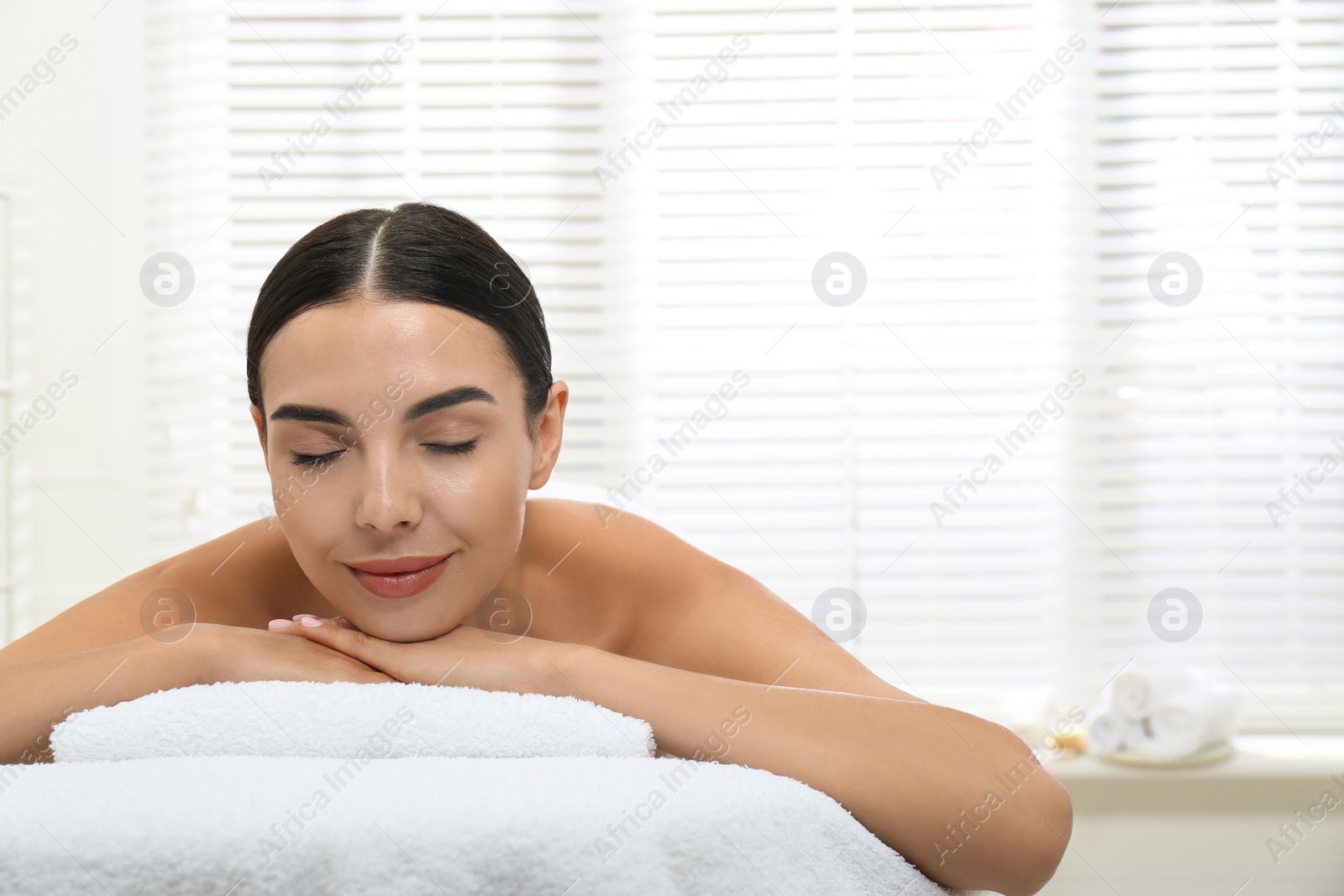 Beautiful young woman relaxing in spa salon Photo of Beautiful young woman relaxing in spa salon