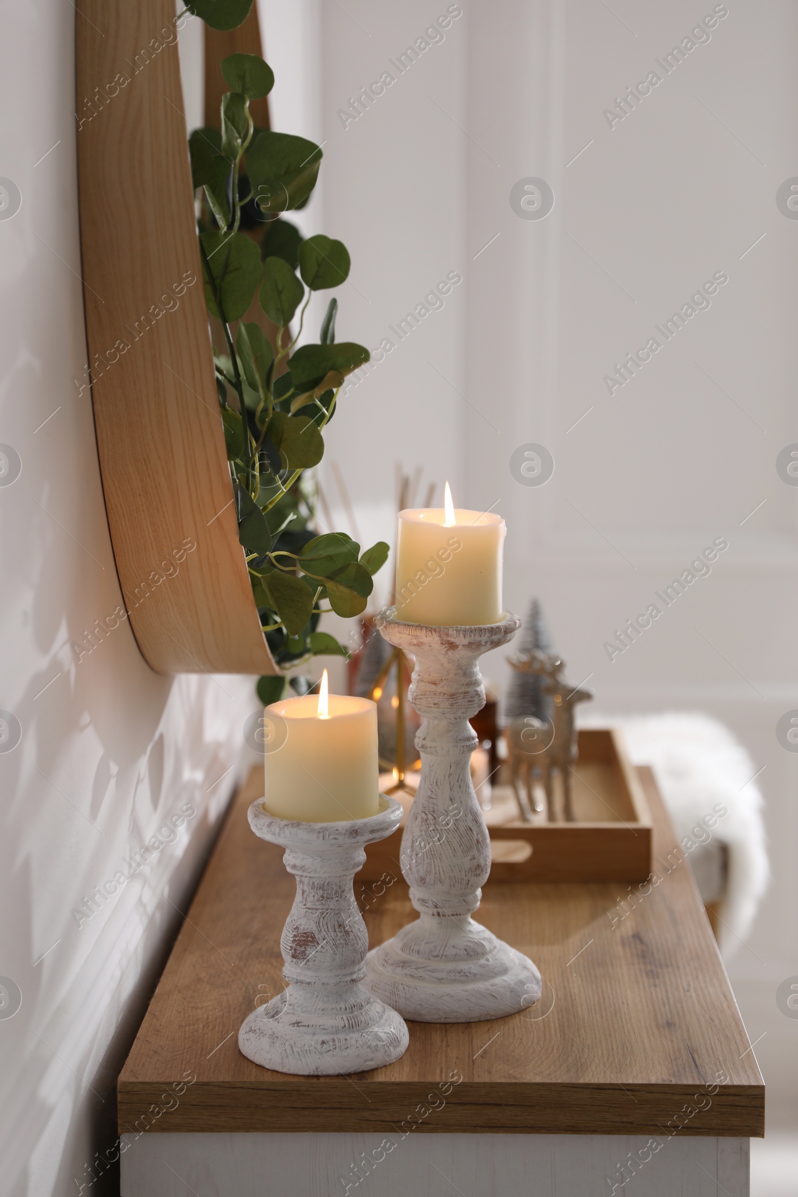 Modern room interior with chest of drawers near white wall Photo of Modern room interior with chest of drawers near white wall