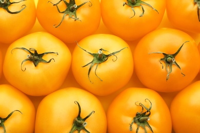 Delicious ripe yellow tomatoes as background, closeup Photo of Delicious ripe yellow tomatoes as background, closeup