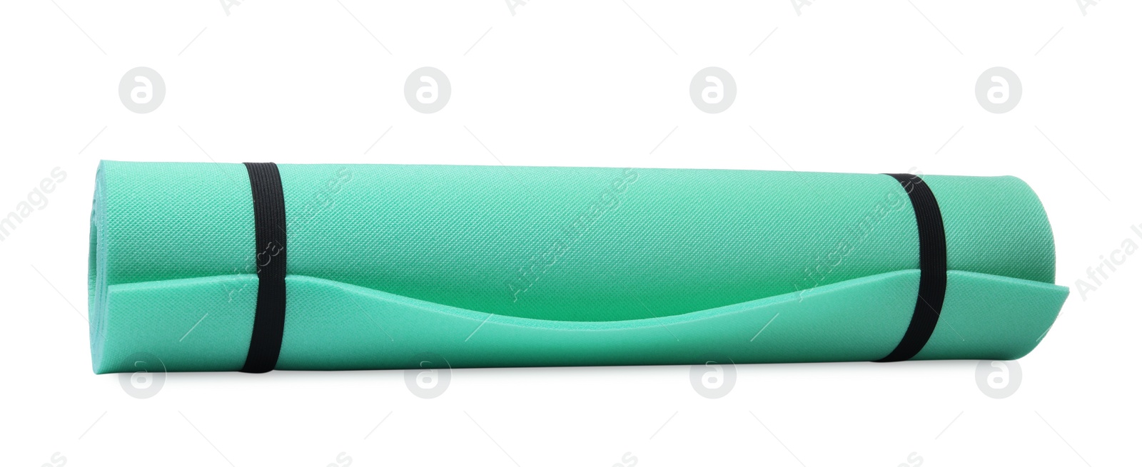 Rolled turquoise camping mat isolated on white Photo of Rolled turquoise camping mat isolated on white