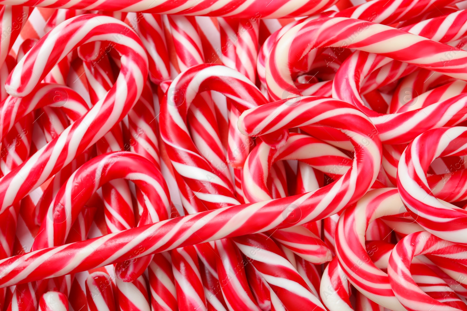 Many sweet Christmas candy canes as background, closeup Photo of Many sweet Christmas candy canes as background, closeup