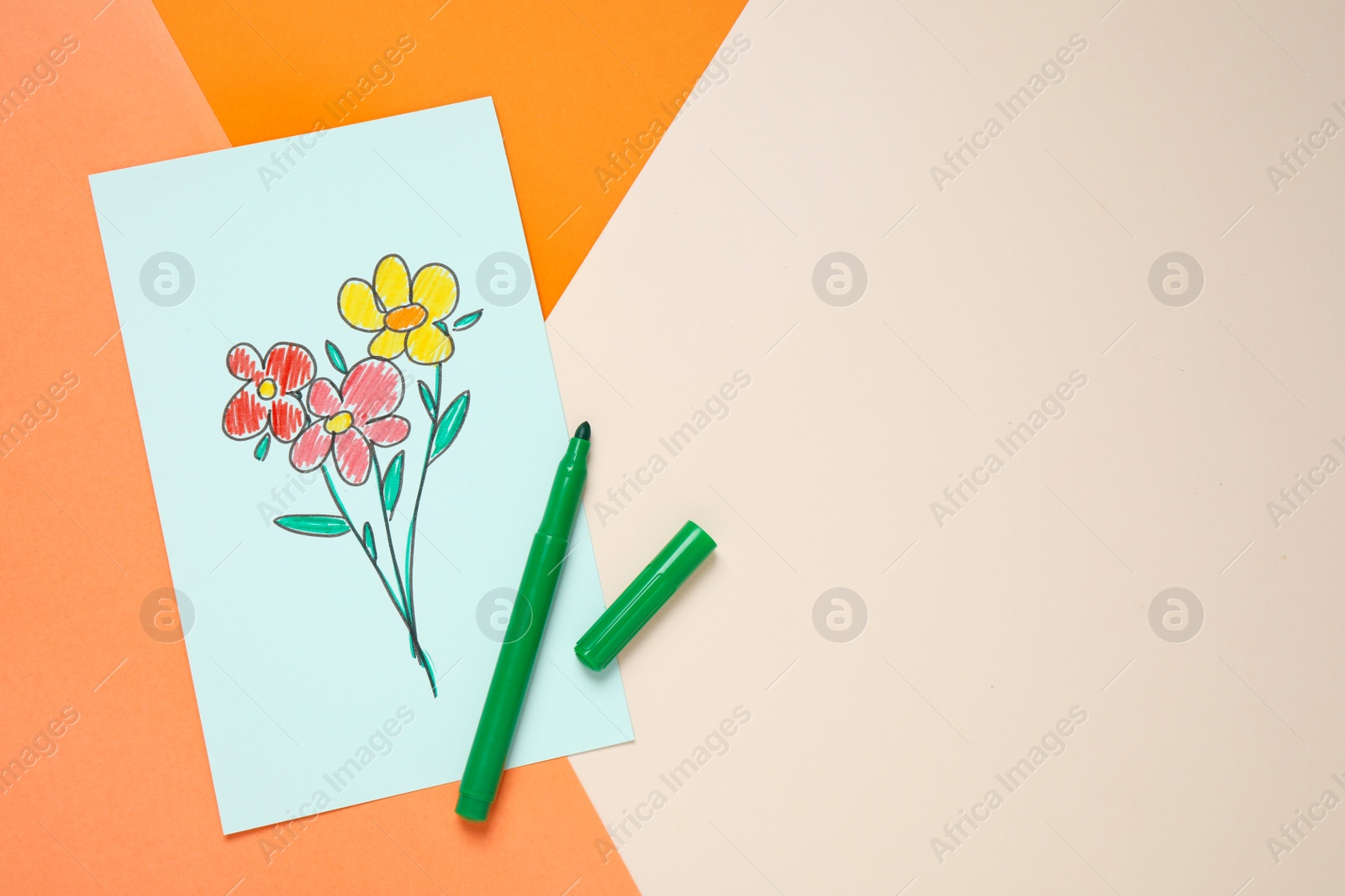 Top view of greeting card with drawn flowers and felt tip pen on color background, space for text. Happy mother's day Photo of Top view of greeting card with drawn flowers and felt tip pen on color background, space for text. Happy mother's day