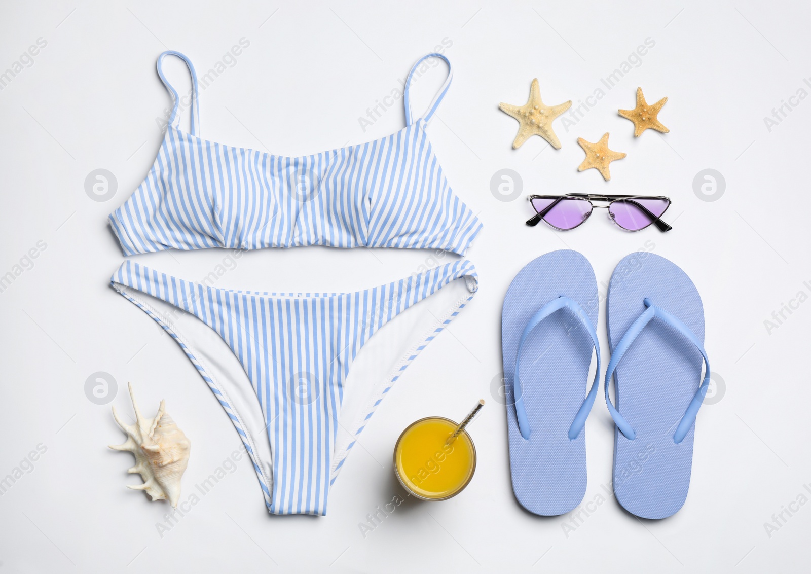 Flat lay composition with beach objects on white background Photo of Flat lay composition with beach objects on white background