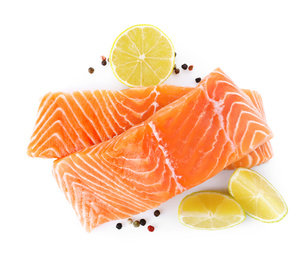 Fresh raw salmon with pepper, lime and lemon on white background, top view. Fish delicacy Photo of Fresh raw salmon with pepper, lime and lemon on white background, top view. Fish delicacy