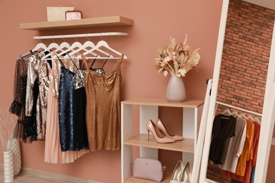 Collection of trendy women's garments in clothing rental salon Photo of Collection of trendy women's garments in clothing rental salon