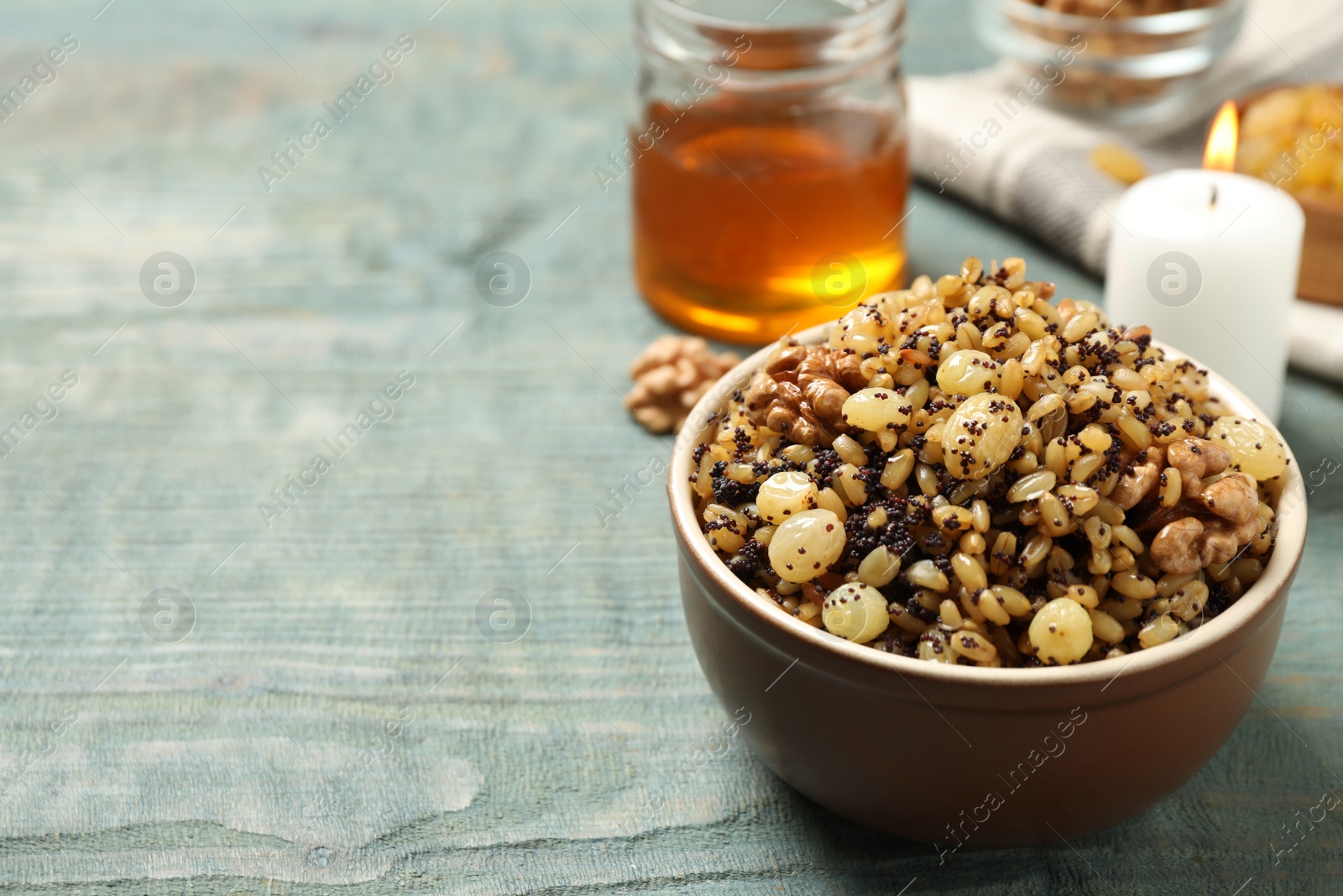 Traditional Christmas slavic dish kutia served on light blue wooden table. Space for text Photo of Traditional Christmas slavic dish kutia served on light blue wooden table. Space for text
