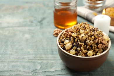 Traditional Christmas slavic dish kutia served on light blue wooden table. Space for text Photo of Traditional Christmas slavic dish kutia served on light blue wooden table. Space for text