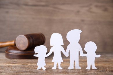 Family figure and judge gavel on wooden table. Family law concept Image of Family figure and judge gavel on wooden table. Family law concept