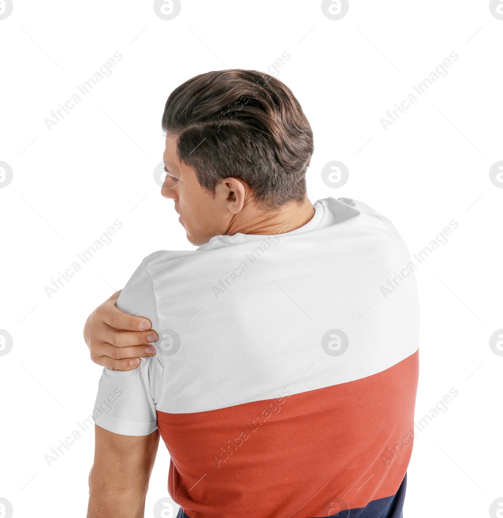 Young man suffering from pain in shoulder on white background Photo of Young man suffering from pain in shoulder on white background