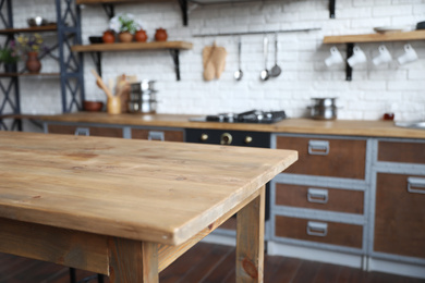 Empty wooden table in beautiful kitchen. Interior design Photo of Empty wooden table in beautiful kitchen. Interior design