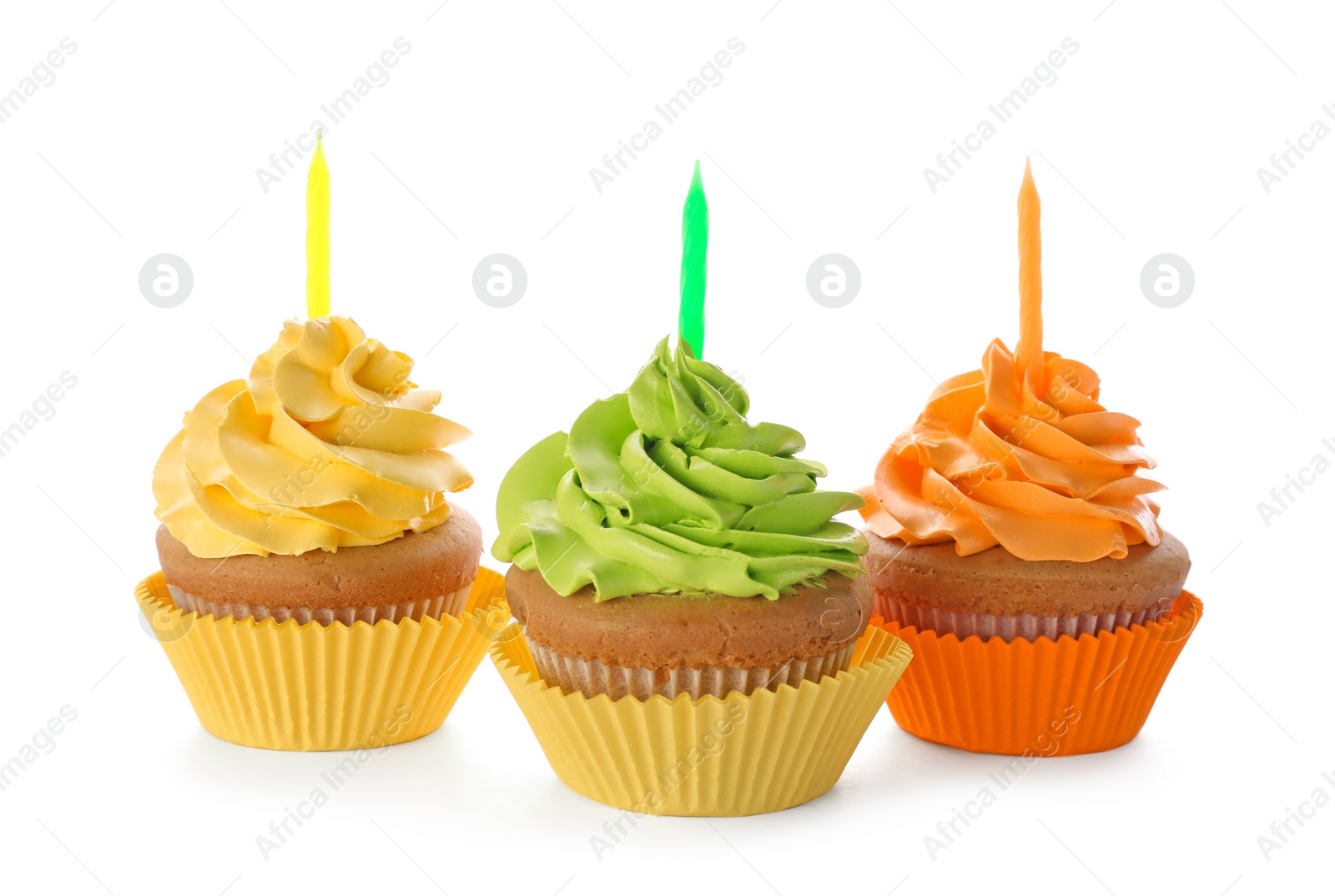 Birthday cupcakes with candles on white background Photo of Birthday cupcakes with candles on white background