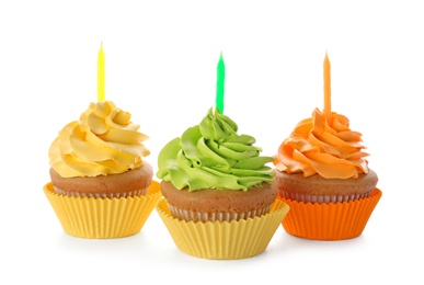 Birthday cupcakes with candles on white background Photo of Birthday cupcakes with candles on white background