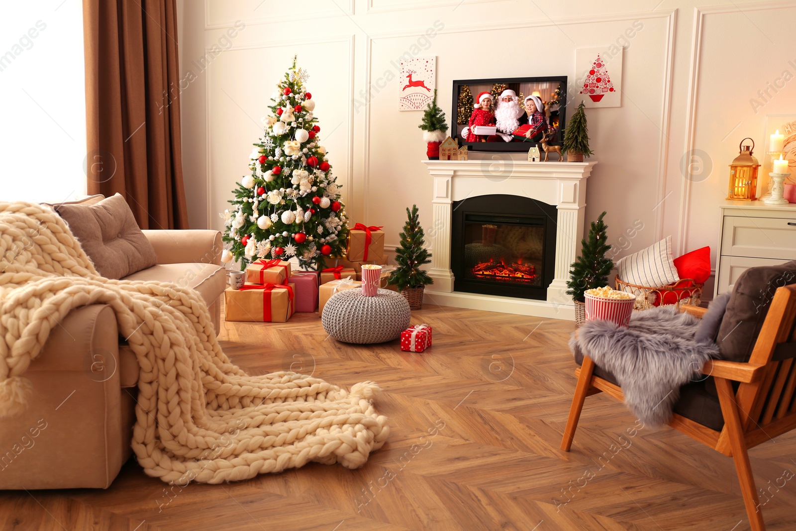 Stylish living room interior with TV set, Christmas tree and fireplace Image of Stylish living room interior with TV set, Christmas tree and fireplace
