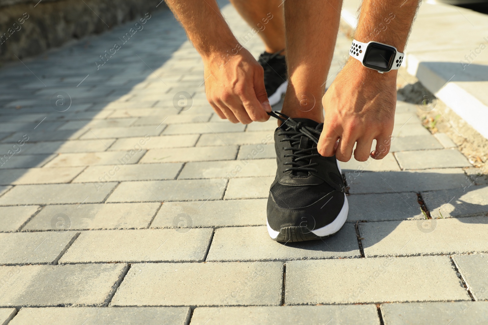 Woman wearing modern smart watch during training outdoors, closeup Photo of Woman wearing modern smart watch during training outdoors, closeup