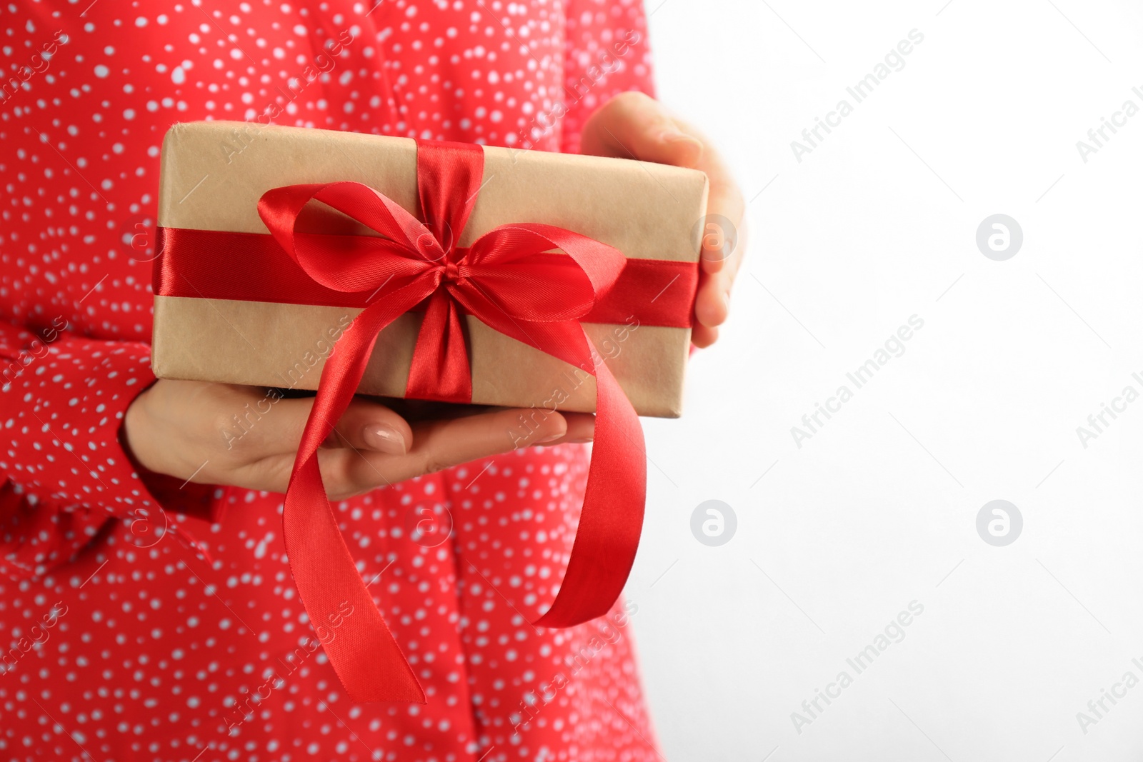 Photo of Woman holding gift box on white background, space for text. Valentine's Day celebration