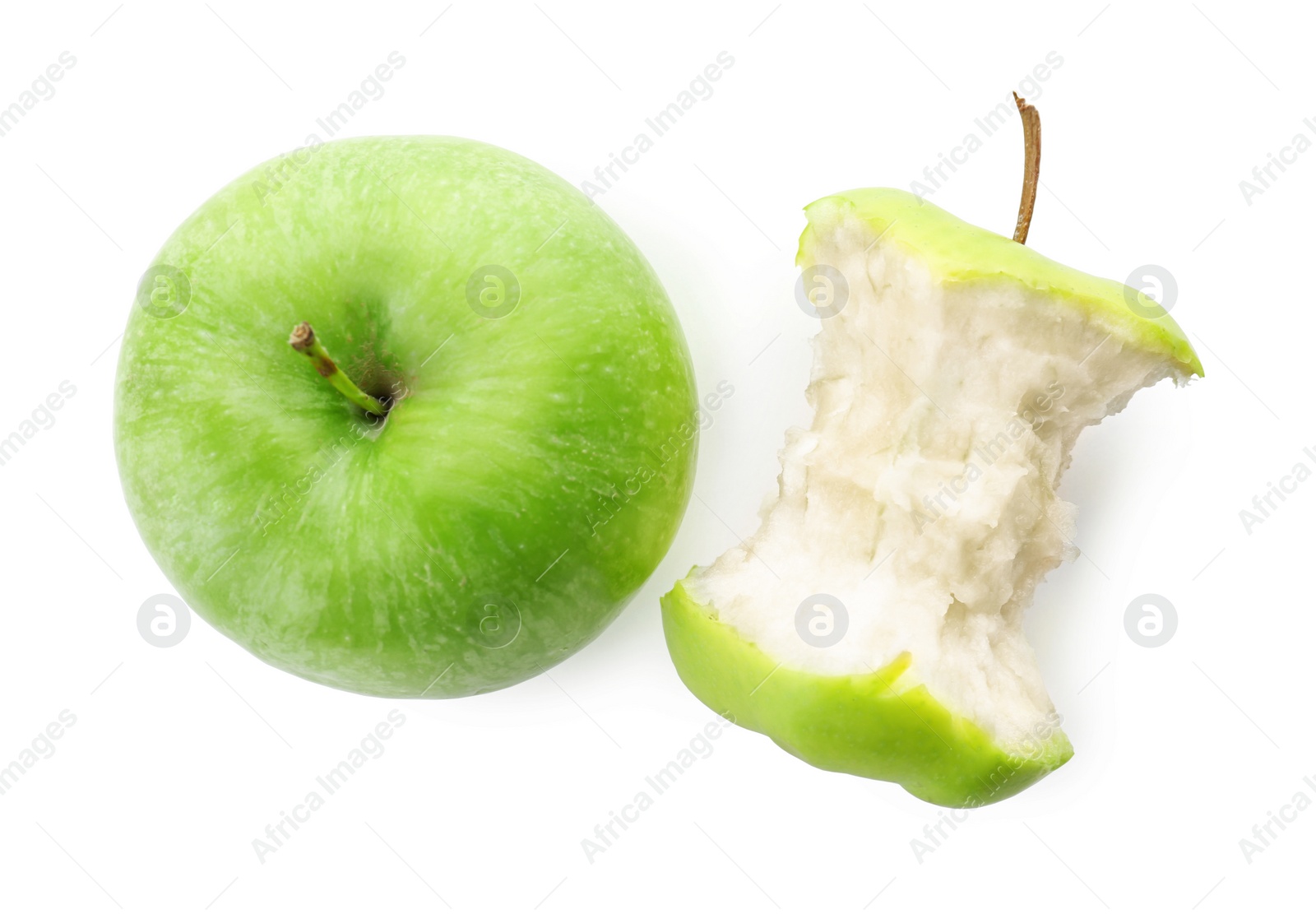 Half-eaten and whole green apple isolated on white Photo of Half-eaten and whole green apple isolated on white