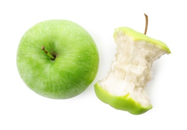 Half-eaten and whole green apple isolated on white Photo of Half-eaten and whole green apple isolated on white