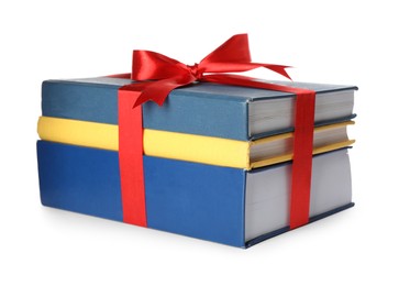 Different books tied with red ribbon isolated on white Photo of Different books tied with red ribbon isolated on white