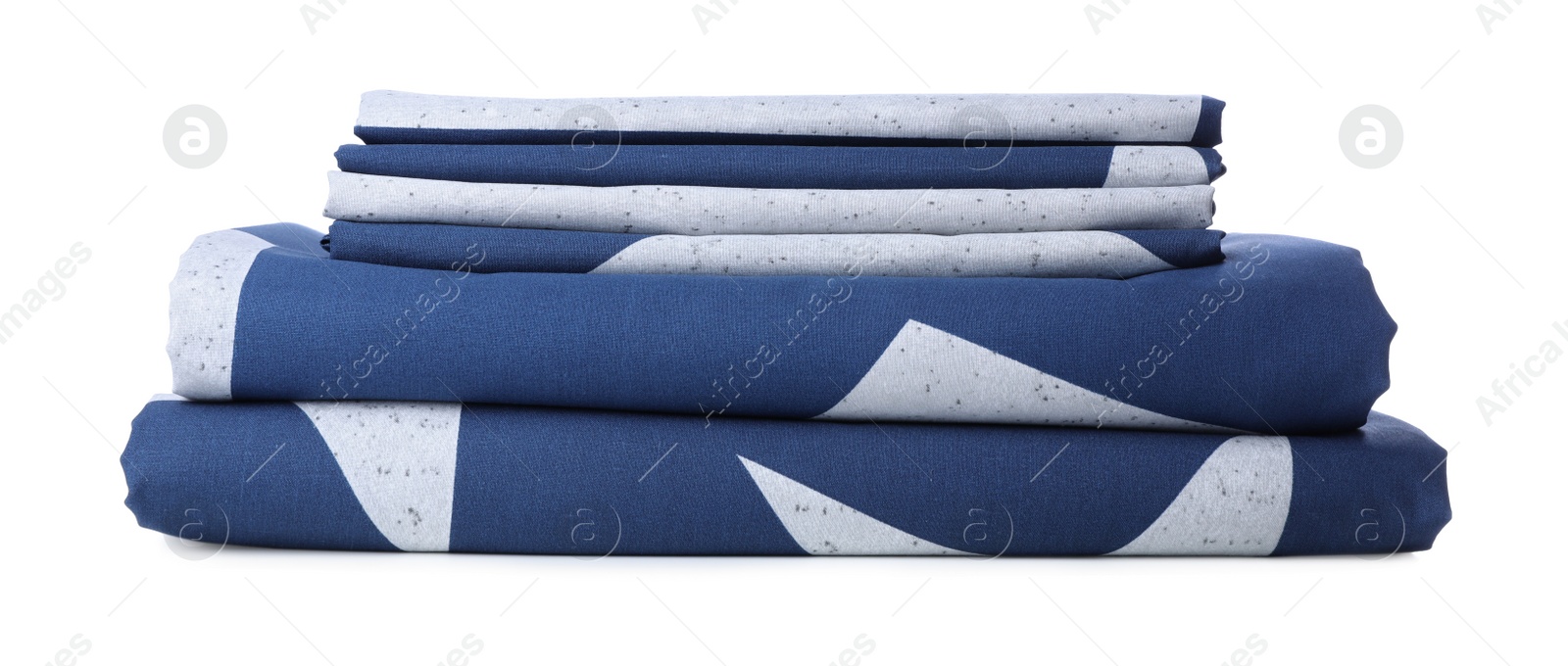 Stack of clean bed linens isolated on white. Child's room interior element Photo of Stack of clean bed linens isolated on white. Child's room interior element