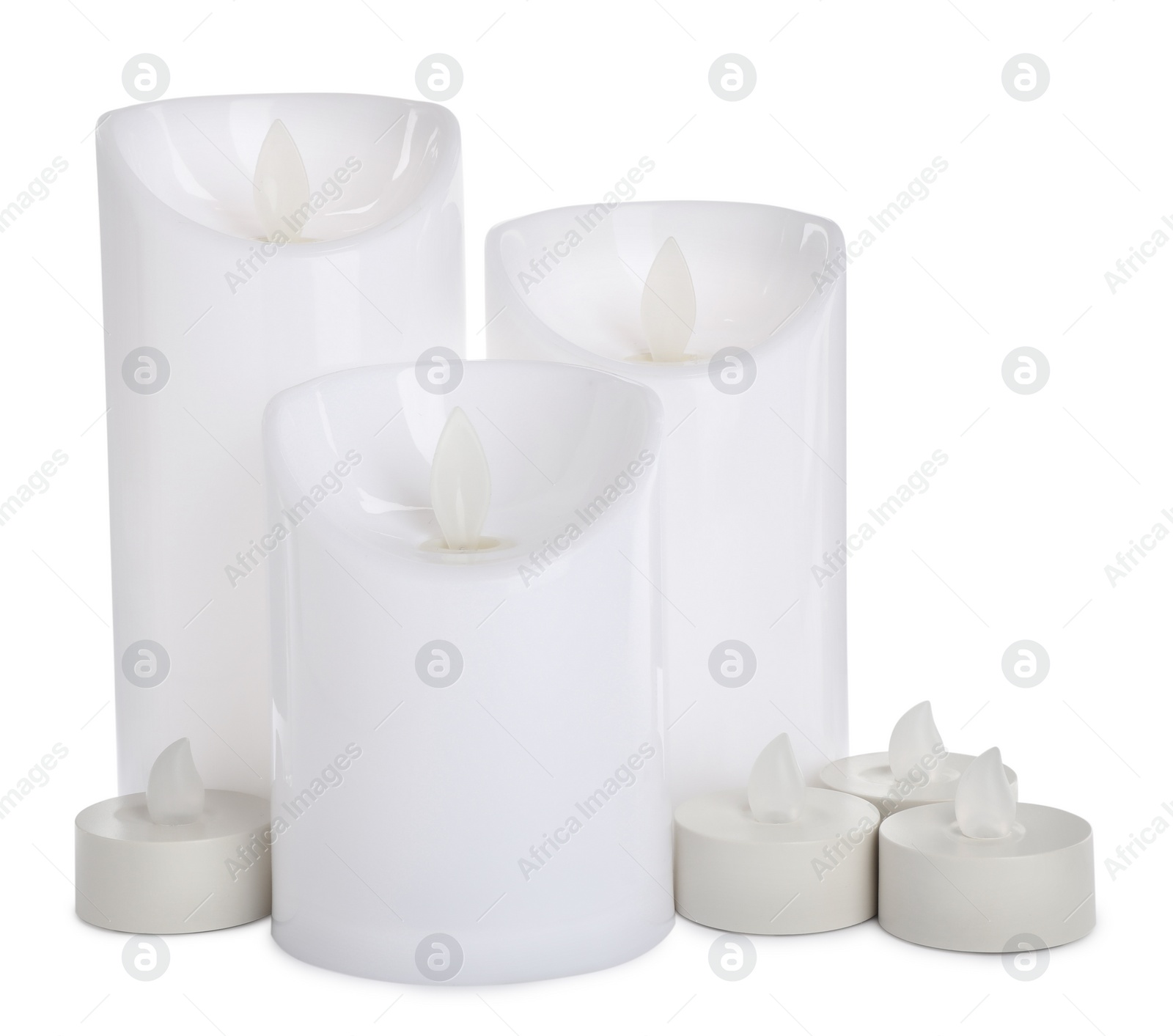 Different decorative flameless LED candles on white background Photo of Different decorative flameless LED candles on white background