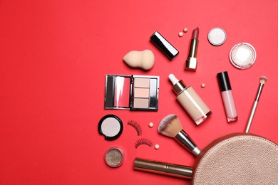 Different makeup products with cosmetic bag on red background, flat lay. Space for text Photo of Different makeup products with cosmetic bag on red background, flat lay. Space for text
