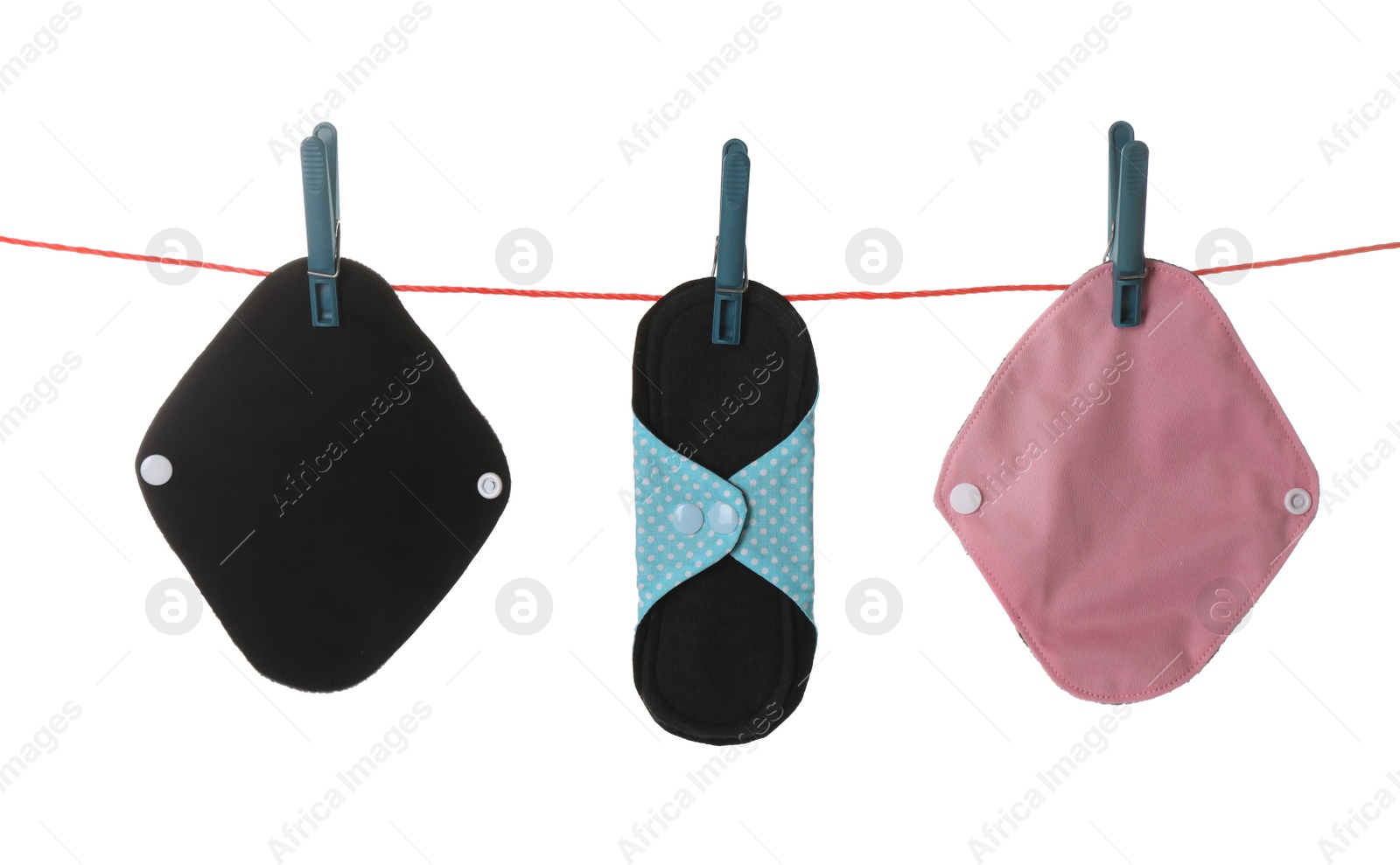 Many different cloth menstrual pads hanging isolated on white Photo of Many different cloth menstrual pads hanging isolated on white