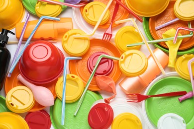 Different colorful plastic items as background, closeup Photo of Different colorful plastic items as background, closeup
