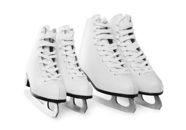 Pairs of figure ice skates isolated on white Photo of Pairs of figure ice skates isolated on white