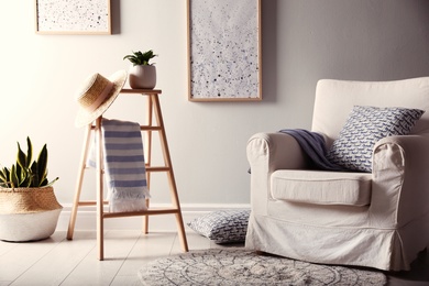 Beautiful room interior with stylish wooden ladder Photo of Beautiful room interior with stylish wooden ladder