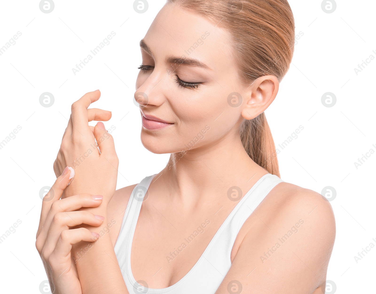 Photo of Young woman applying body cream on white background