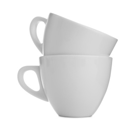 Empty clean ceramic cups on white background Photo of Empty clean ceramic cups on white background