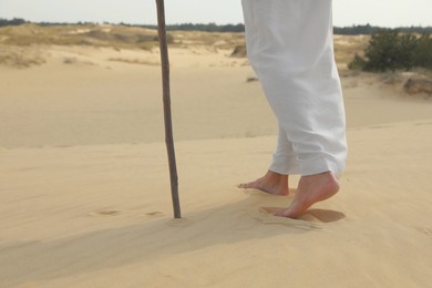 Jesus Christ walking in desert, closeup view Photo of Jesus Christ walking in desert, closeup view