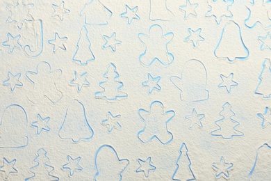 Photo of Different Christmas cookie shapes made of flour on light blue background, top view