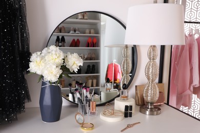 Stylish dressing table in modern wardrobe room Photo of Stylish dressing table in modern wardrobe room
