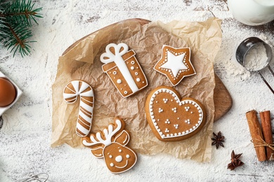 Flat lay composition with delicious homemade Christmas cookies on wooden table Photo of Flat lay composition with delicious homemade Christmas cookies on wooden table