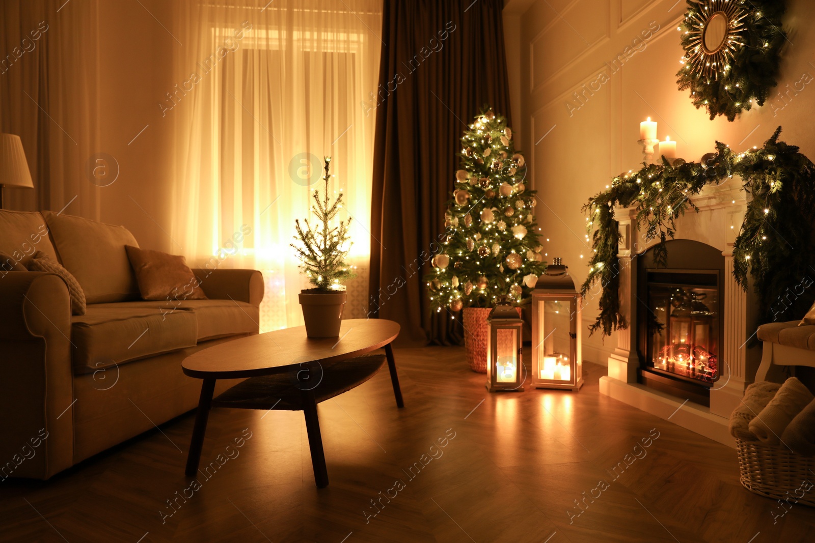 Beautiful room interior with fireplace and Christmas decor in evening Photo of Beautiful room interior with fireplace and Christmas decor in evening