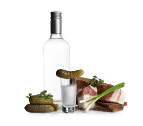 Russian vodka and different appetizers isolated on white Photo of Russian vodka and different appetizers isolated on white