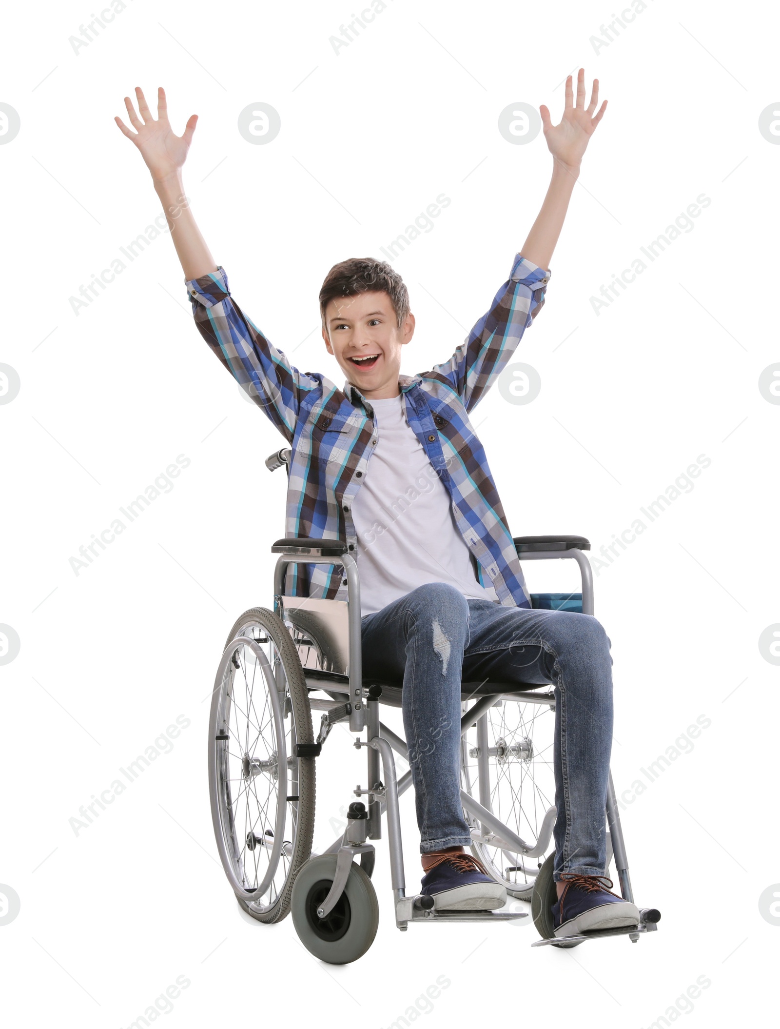 Emotional teen boy in wheelchair on white background Photo of Emotional teen boy in wheelchair on white background